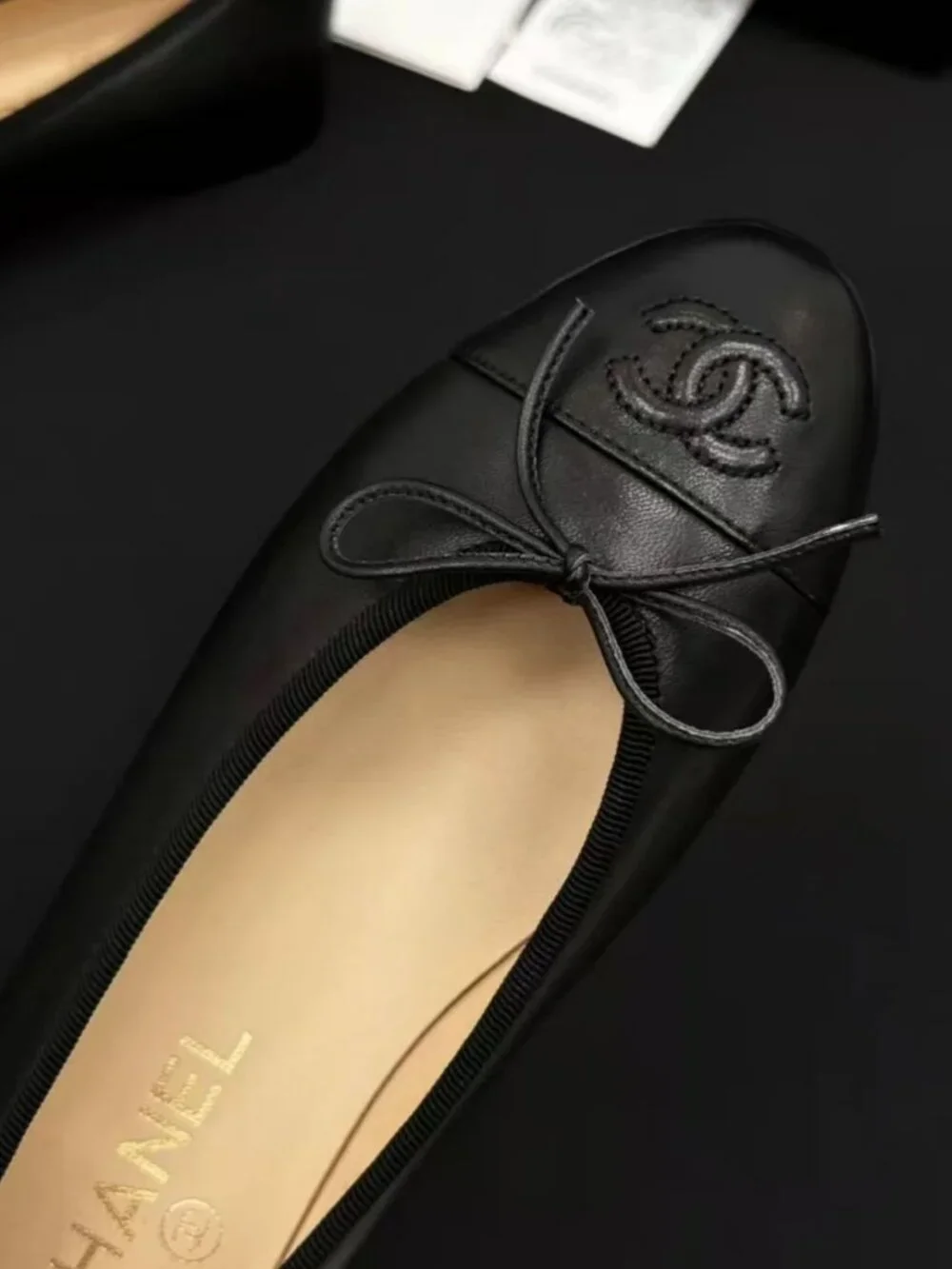 CHANEL All-Black Leather Bow Embossed CC Ballerina Flat Shoes